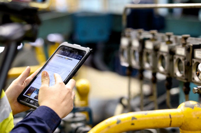 Close up of an employee holding a tablet